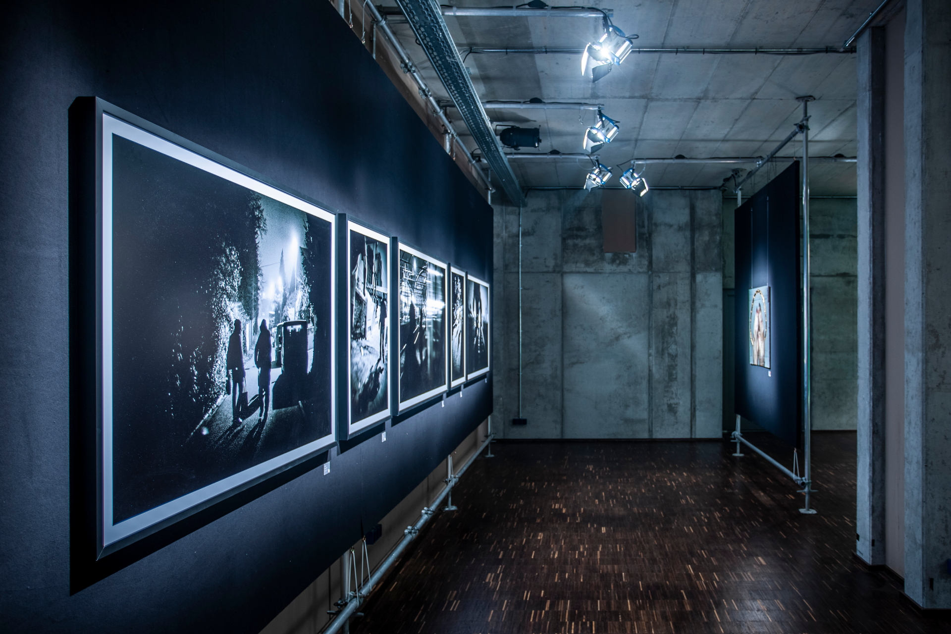 Installation detail — framed BACKFLASHES works along the gallery wall