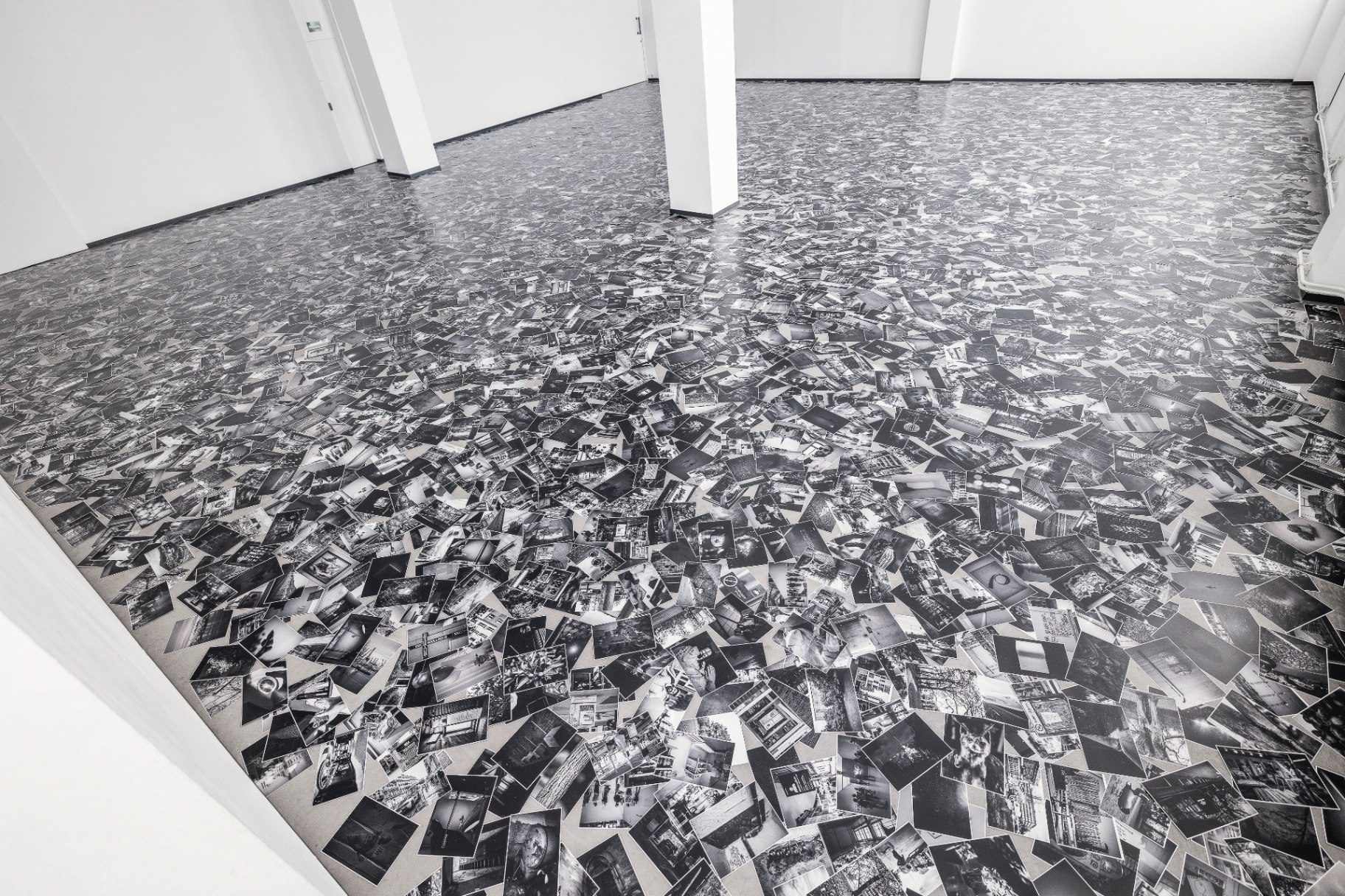 Installation detail — the photographic floor extending wall to wall