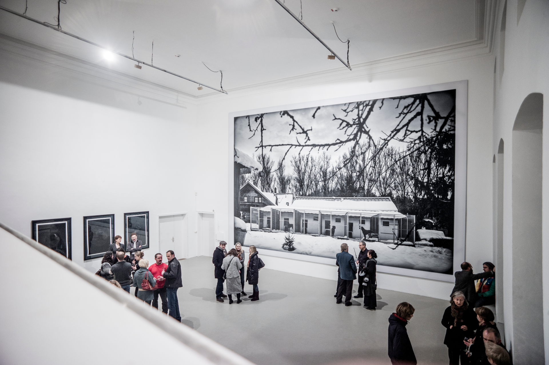 Installation detail — portrait sequence across the wall