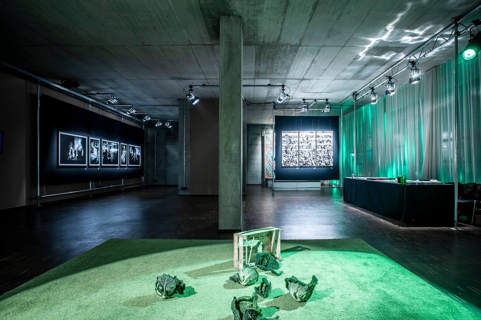 Installation view — exhibition overview with floor installation and framed works