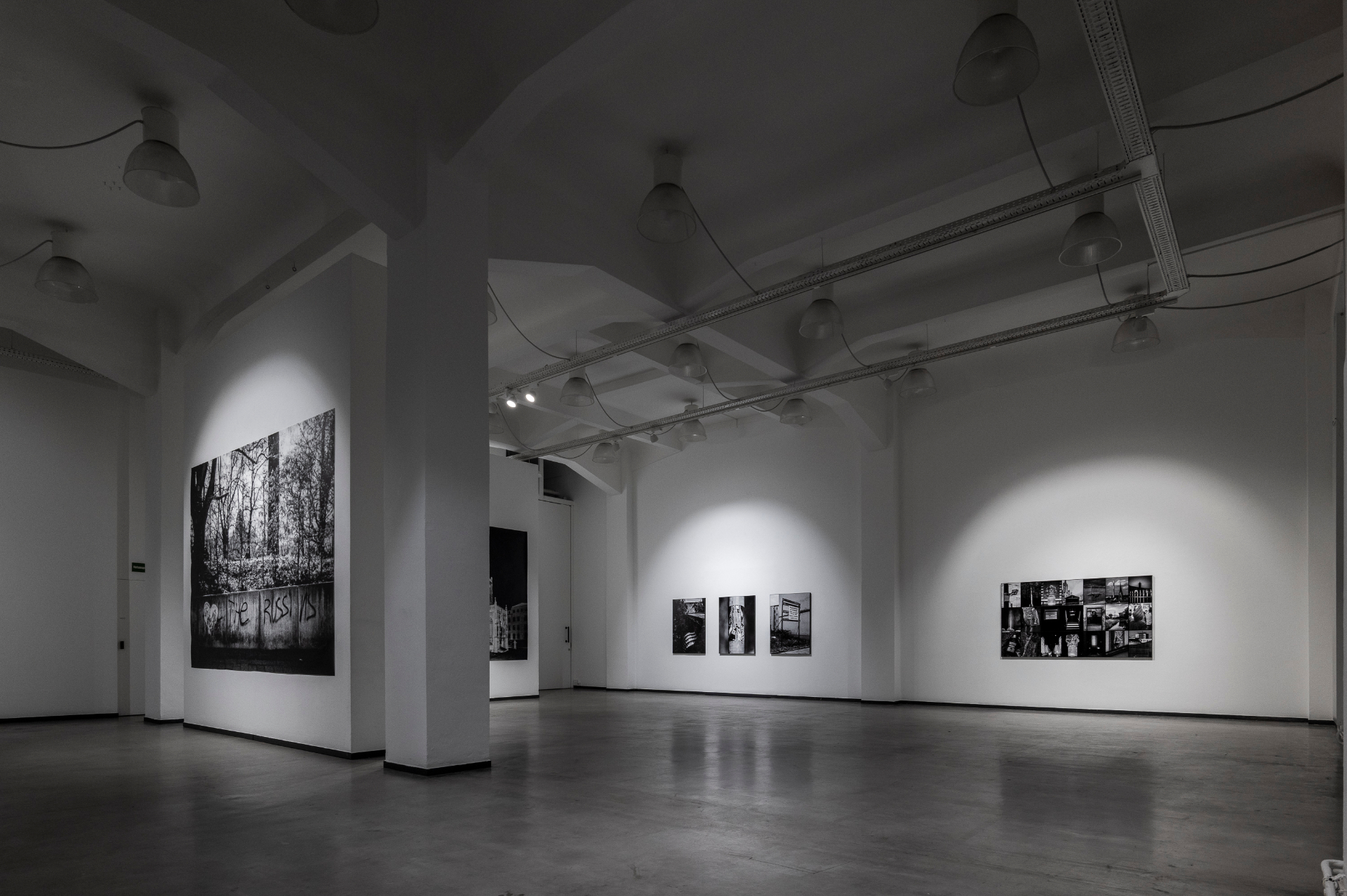 Installation detail — framed works in a dense, rhythmic hang